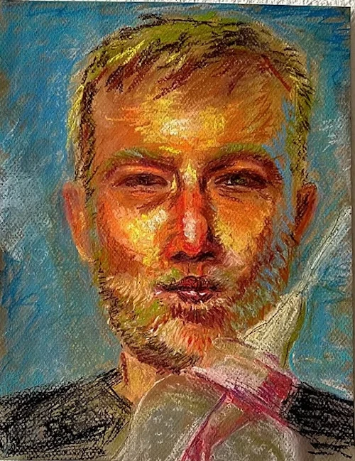 Pastel portrait of a bearded man in warm light on a blue ground